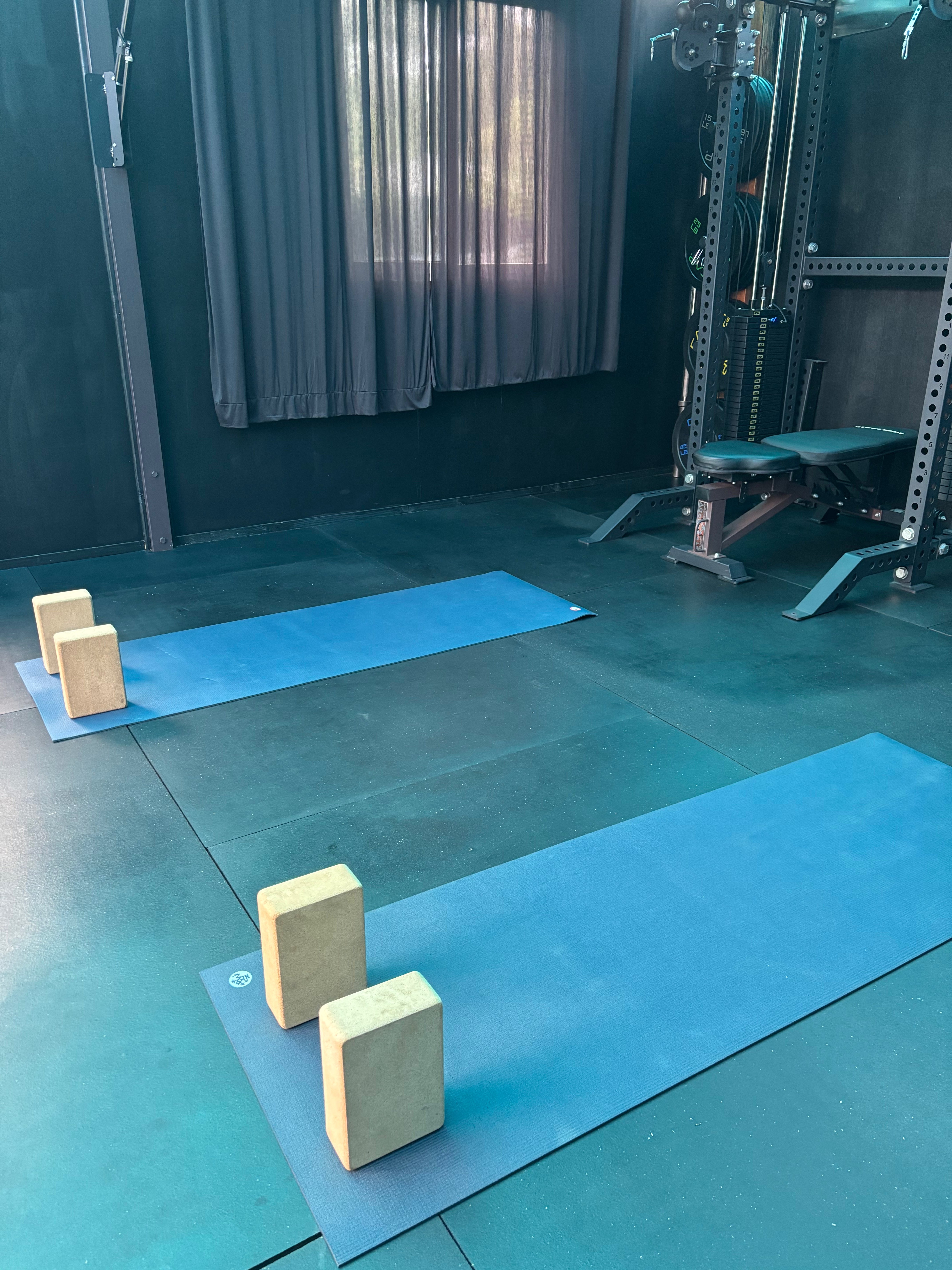 The Blue Room Movement Studio interior with yoga mats and equipment
